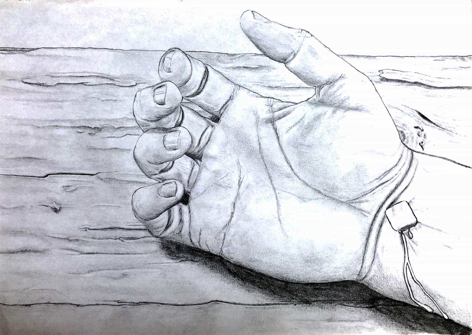 An image of Jesus' hand nailed to a cross.