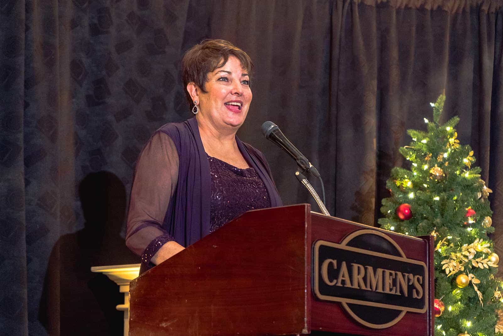 Martie van Niekerk standing behind the pulpit